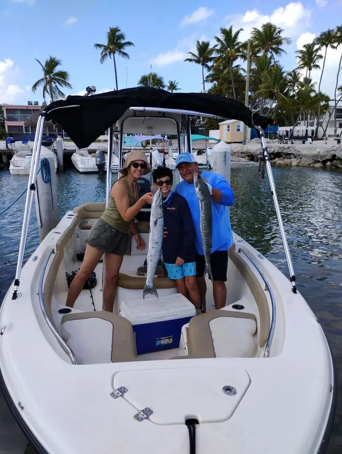 Family fishing day on a rental boat